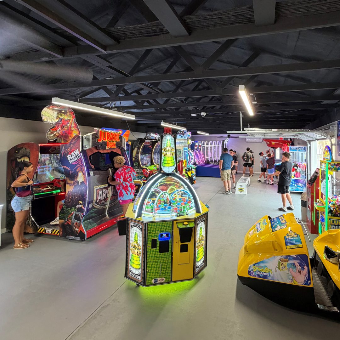 Kids and parents playing games in the Clubhouse arcade